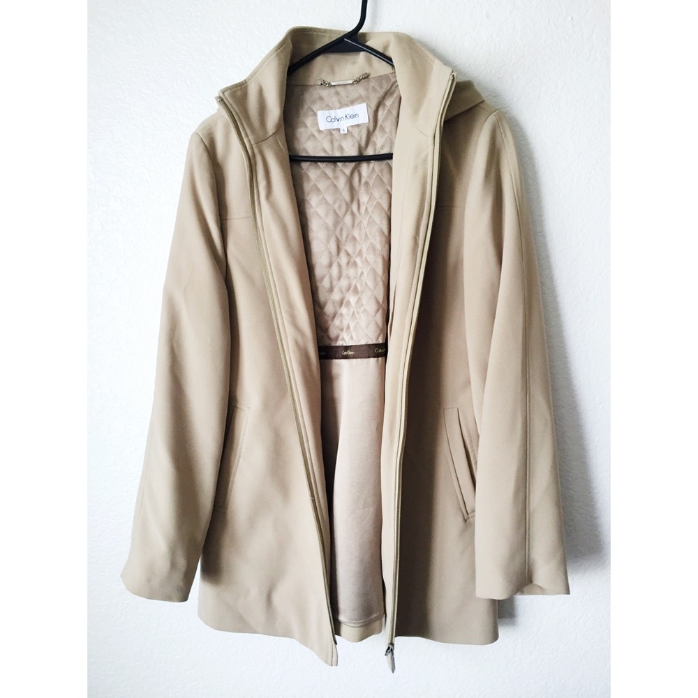Calvin Klein cream colored jacket and necklace